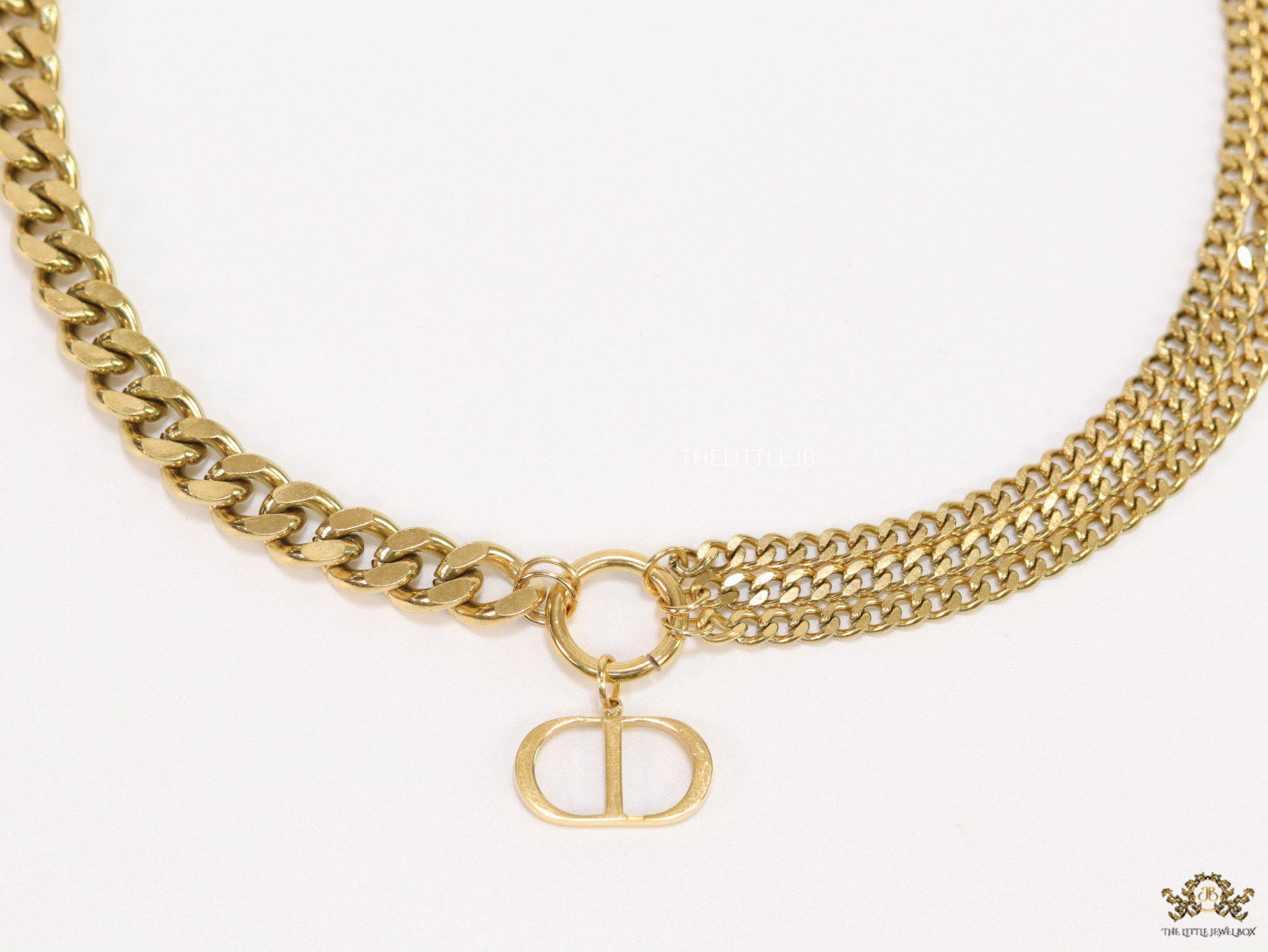 Multiple golden chain necklace with alphabet pendant