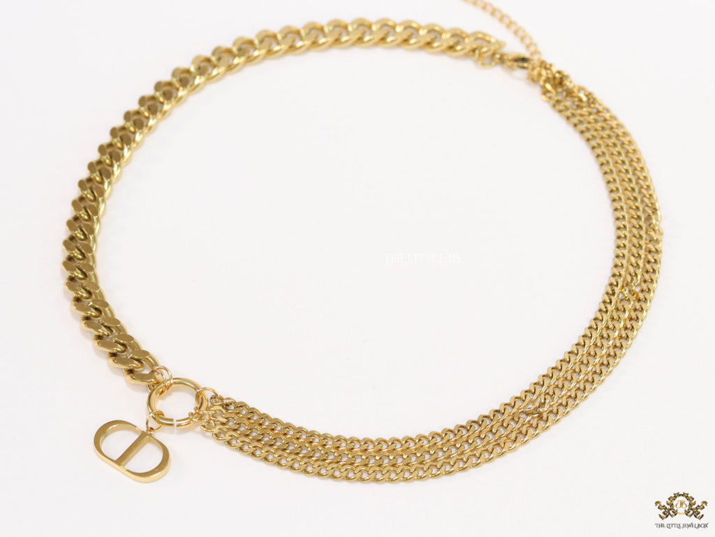 Multiple golden chain necklace with alphabet pendant