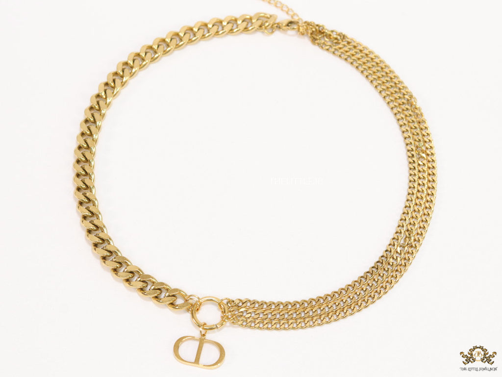 Multiple golden chain necklace with alphabet pendant