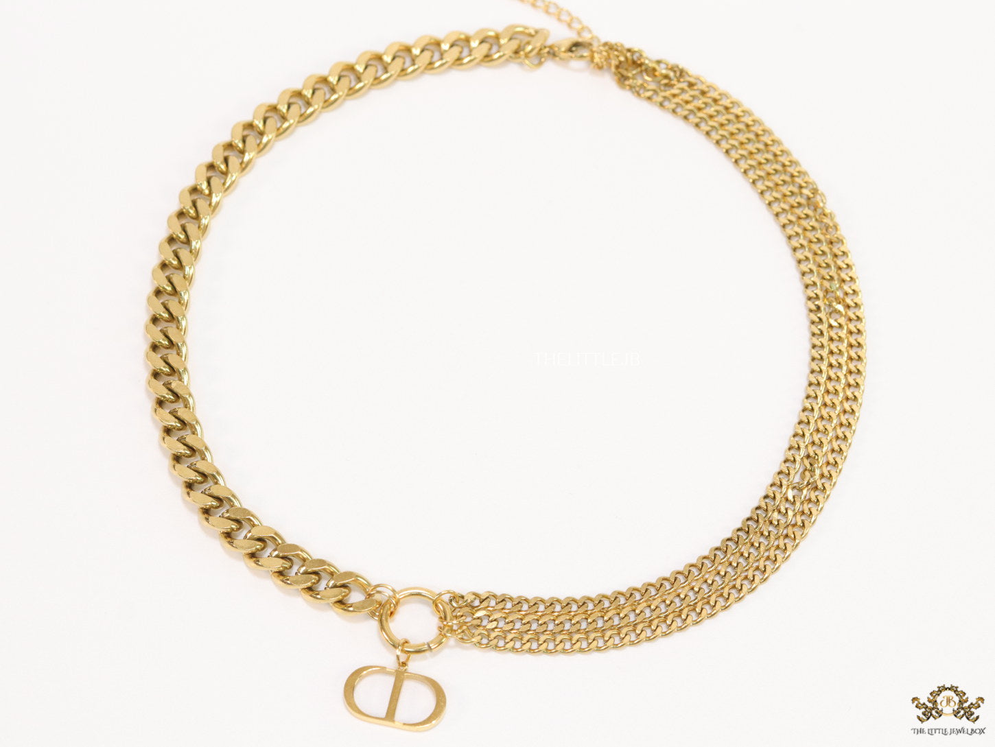 Multiple golden chain necklace with alphabet pendant