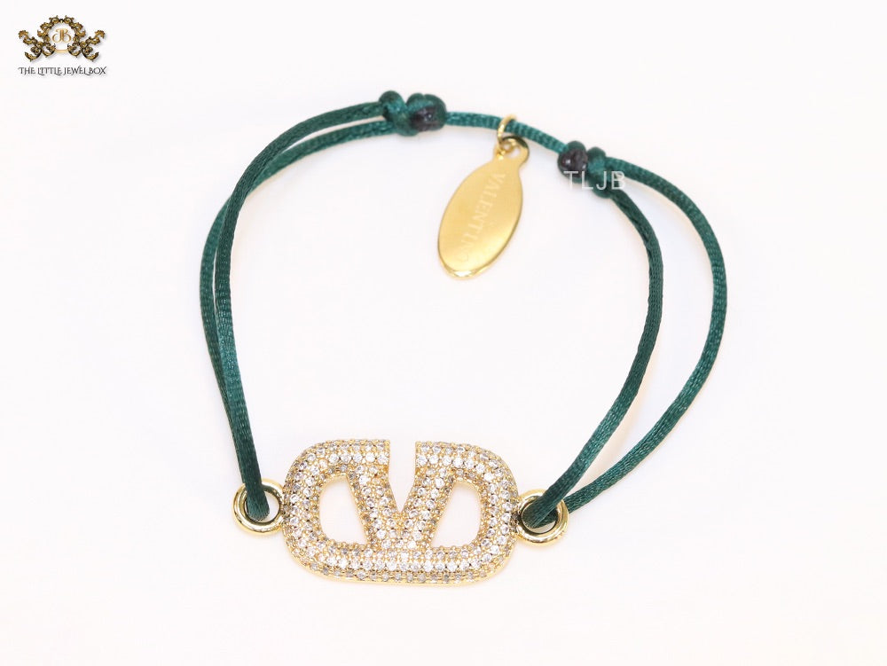 Alphabet V gold cz on green thread