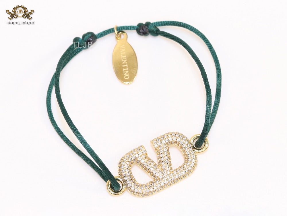 Alphabet V gold cz on green thread