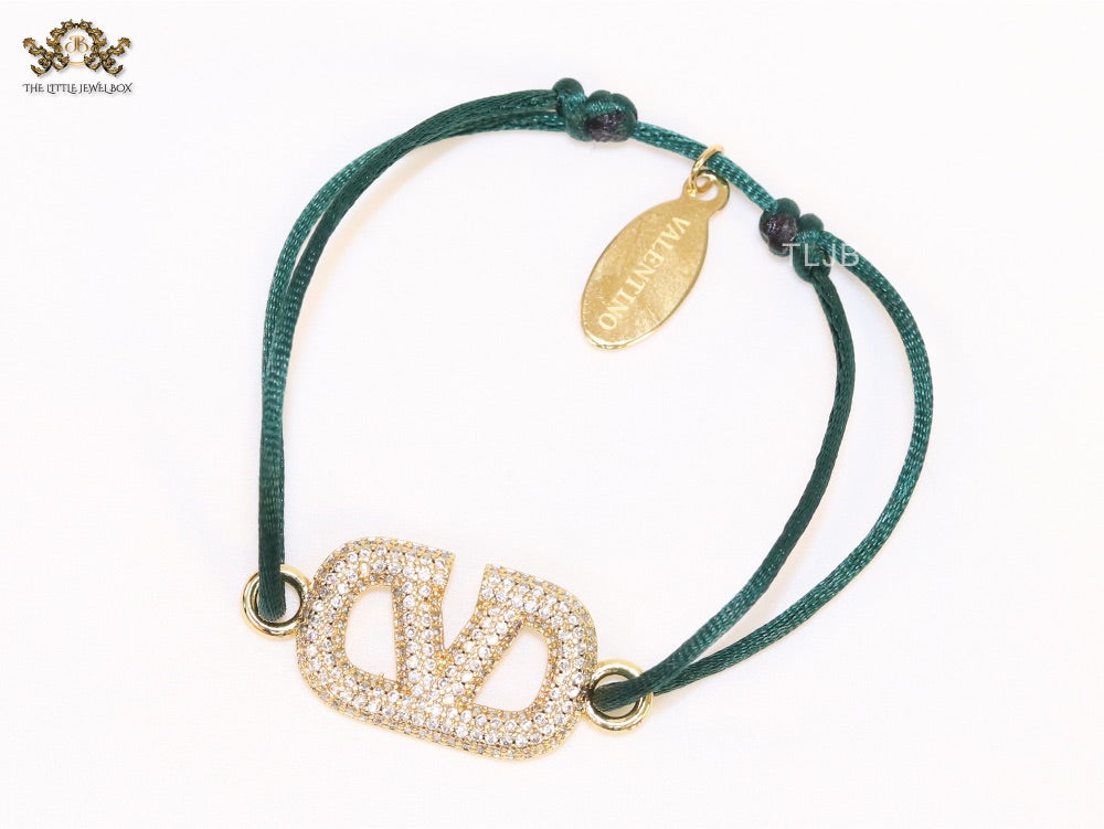 Alphabet V gold cz on green thread