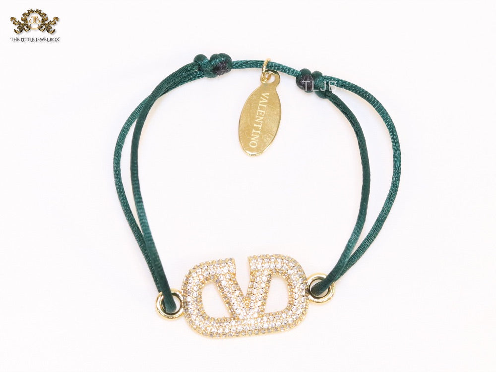 Alphabet V gold cz on green thread