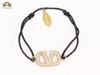 Alphabet V gold cz on black thread Bracelet