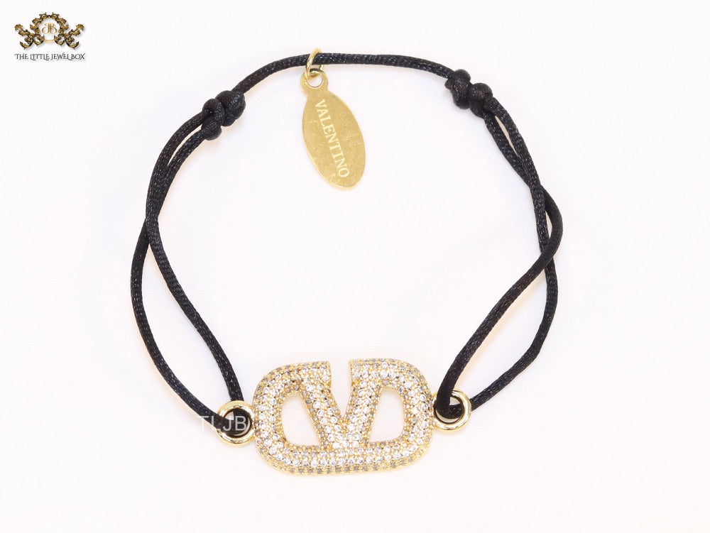 Alphabet V gold cz on black thread Bracelet