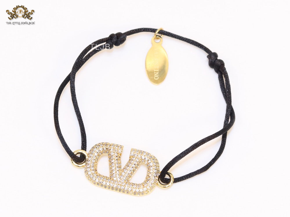 Alphabet V gold cz on black thread Bracelet