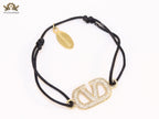 Alphabet V gold cz on black thread Bracelet