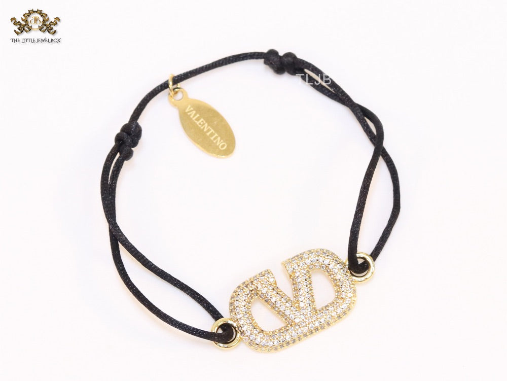 Alphabet V gold cz on black thread Bracelet