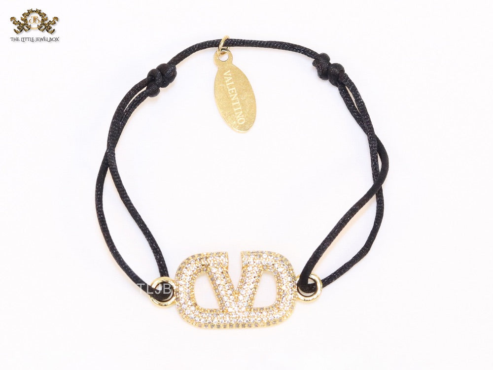 Alphabet V gold cz on black thread Bracelet