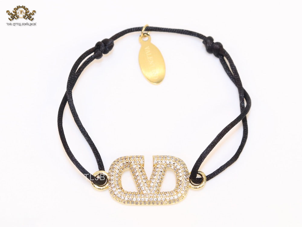 Alphabet V gold cz on black thread Bracelet