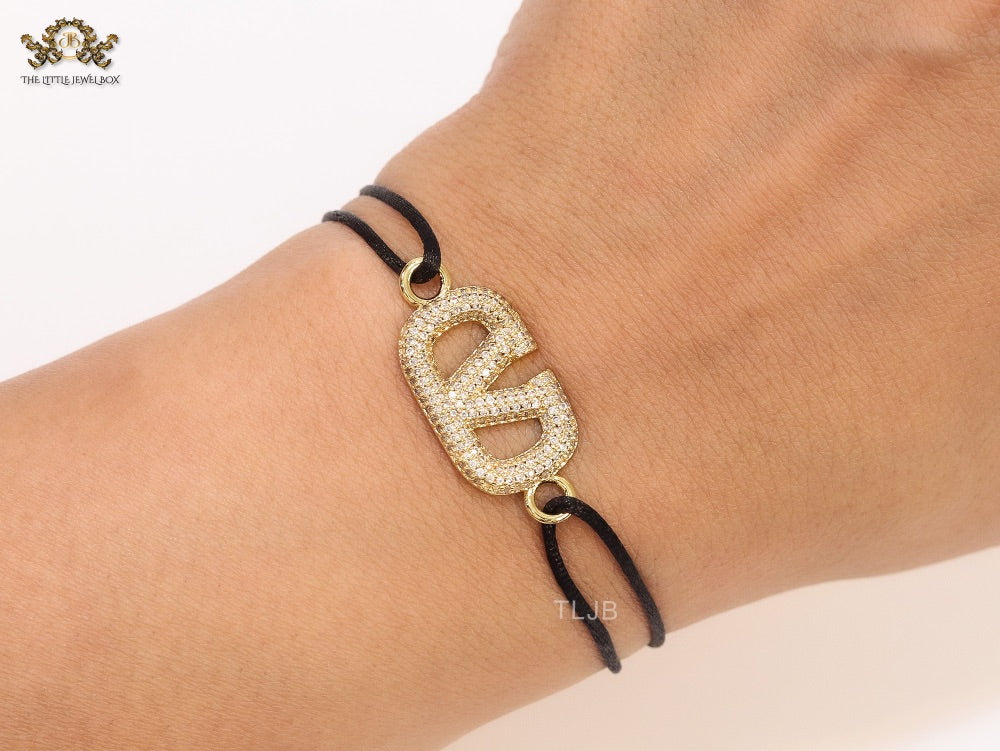 Alphabet V gold cz on black thread Bracelet
