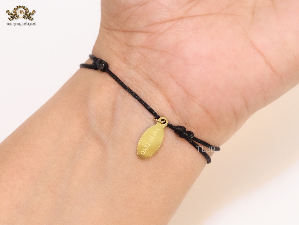 Alphabet V gold cz on black thread Bracelet