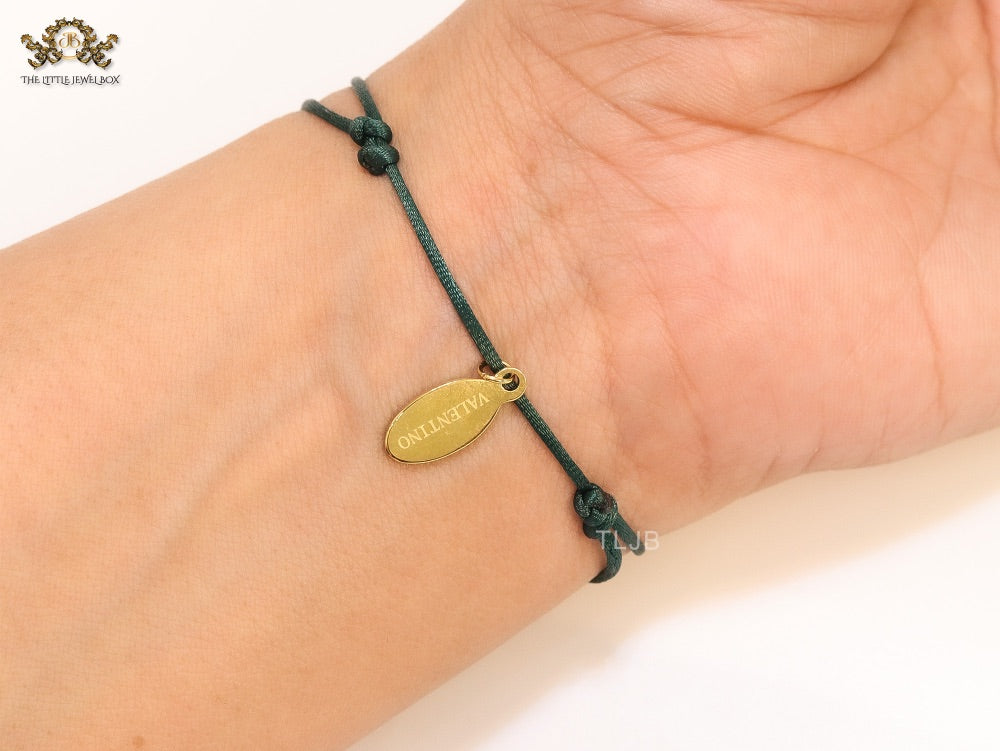 Alphabet V gold cz on green thread