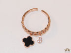 Rose gold plated link chain ring with black clover and cz drop