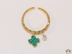 Gold plated link chain ring with malachite green clover and cz drop