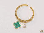 Gold plated link chain ring with malachite green clover and cz drop