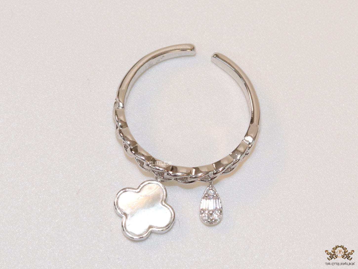 Platinum plated link chain ring with MOP clover and cz drop