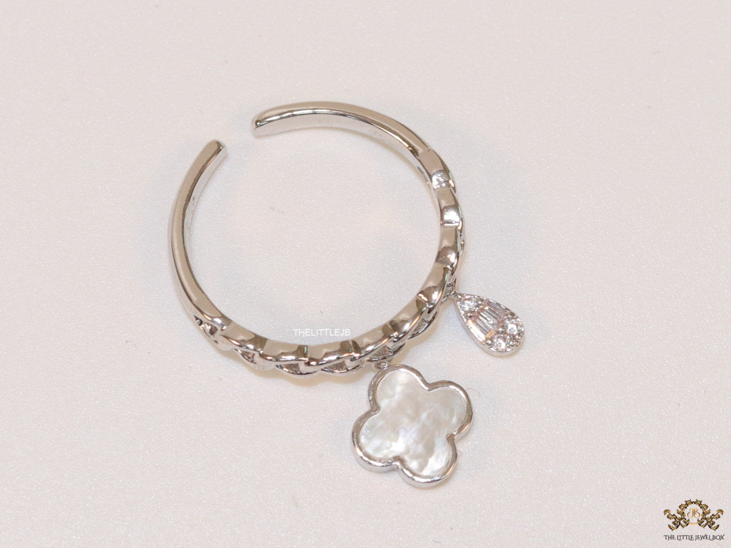 Platinum plated link chain ring with MOP clover and cz drop