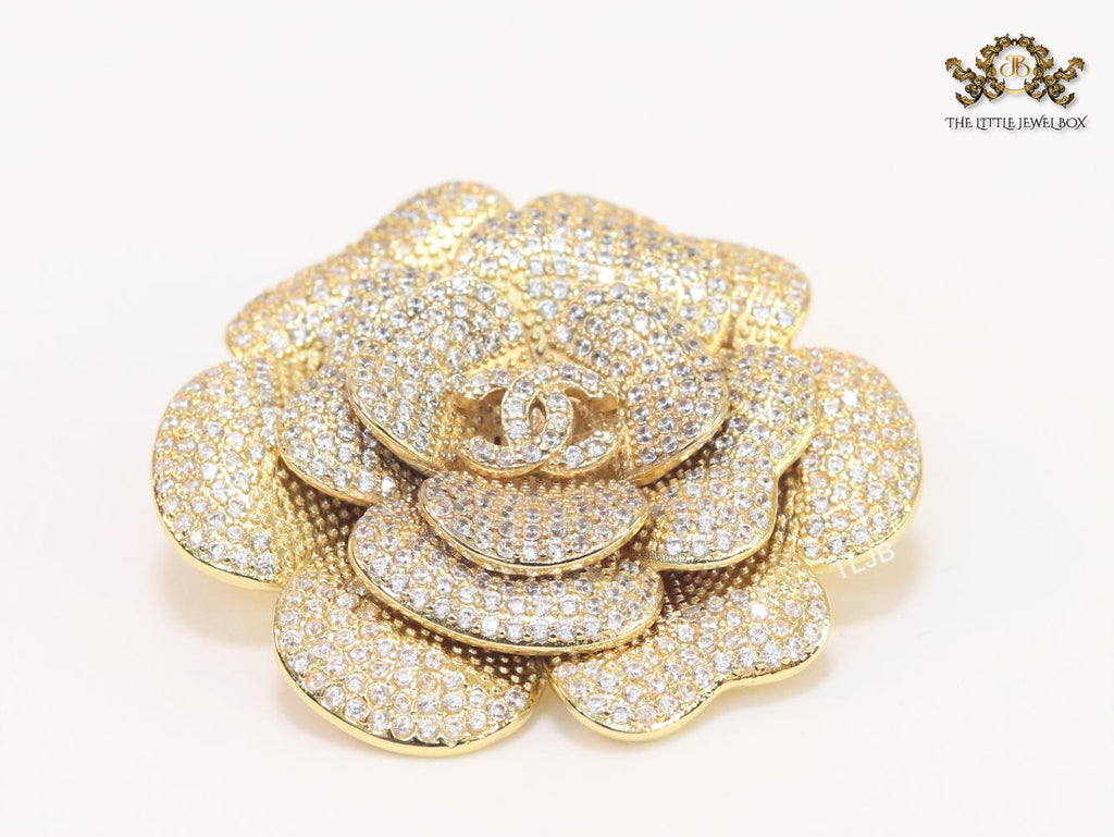 Double C gold & cz flower brooch