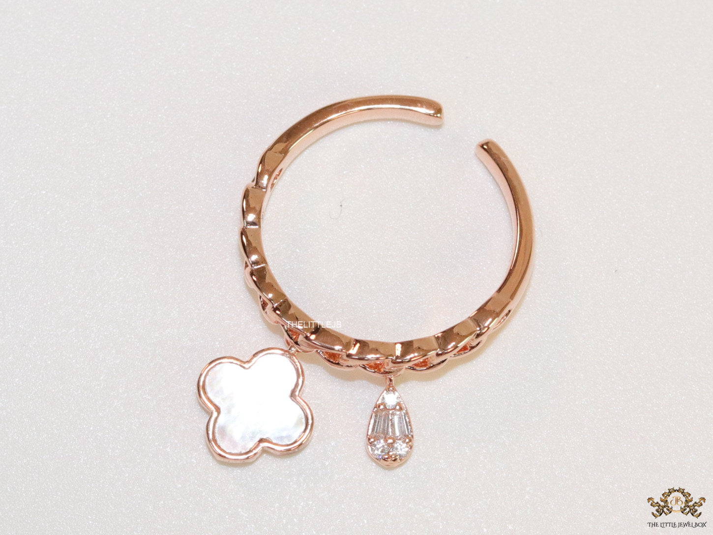 Rose gold plated link chain ring with MOP clover and cz drop