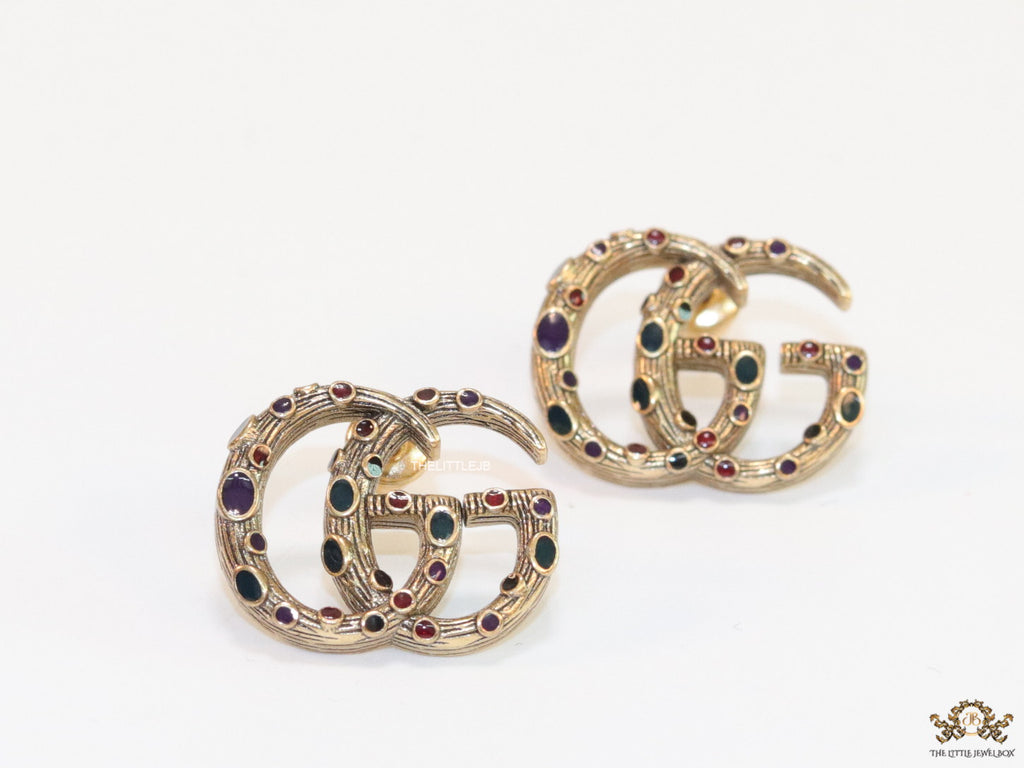 Antique gold plated twin G motif studs with multicoloured enamel