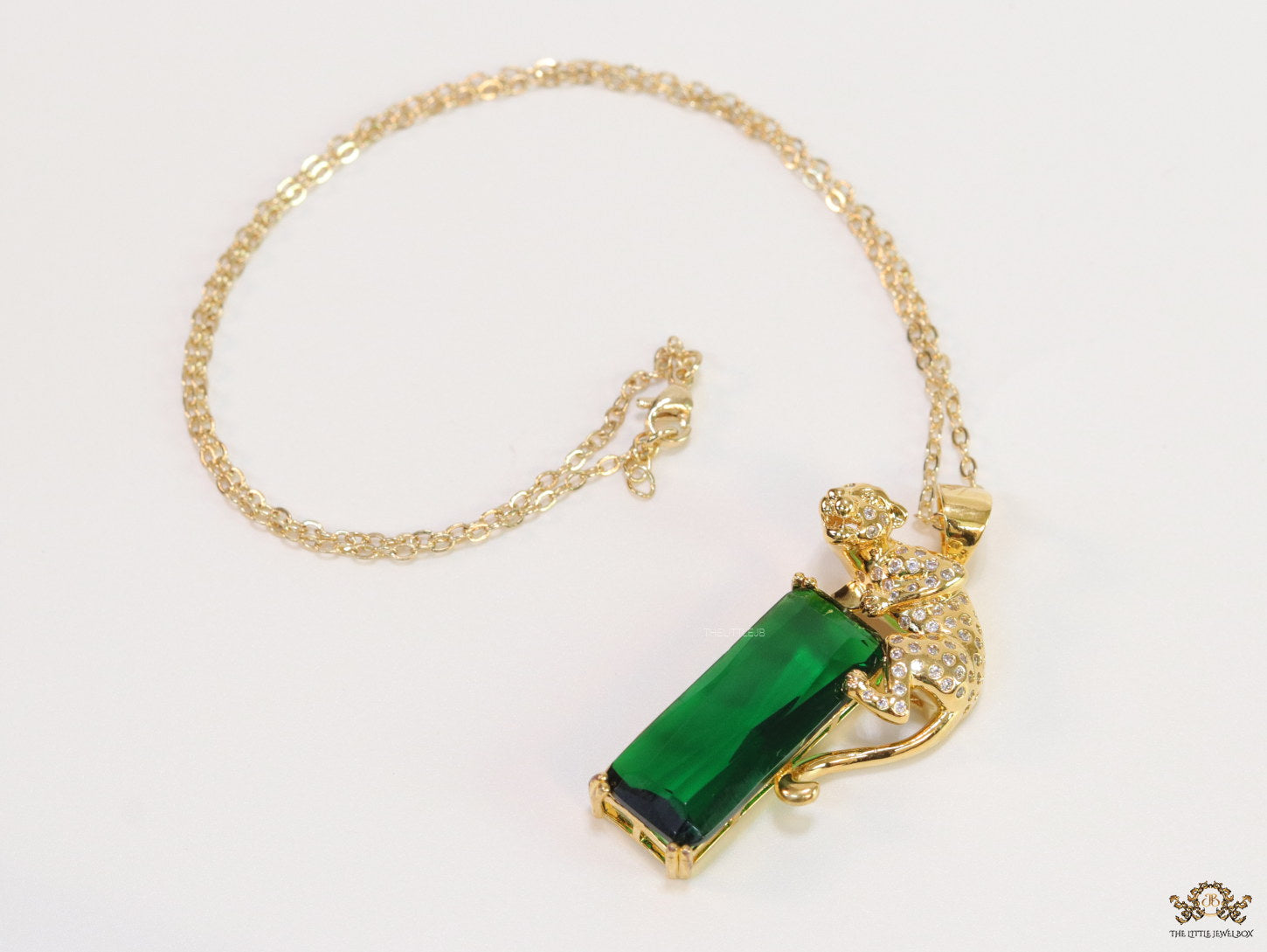 Gold plated leopard on green stone pendant necklace with cz