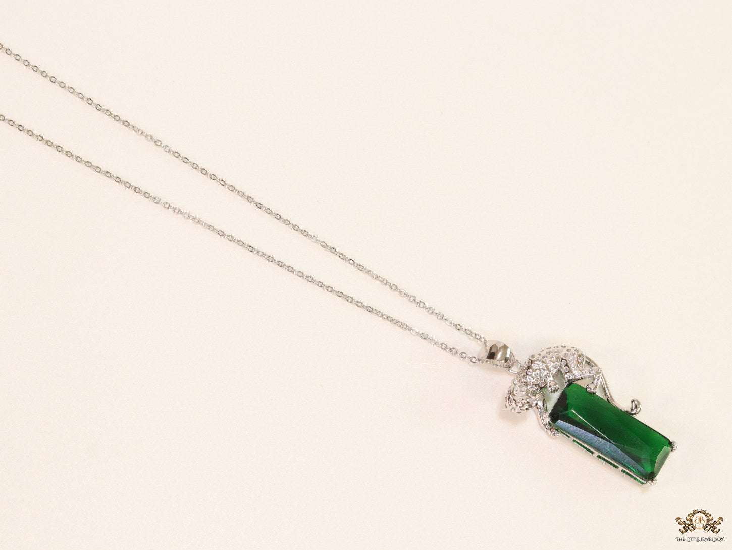 Platinum plated leopard on green stone pendant necklace with cz