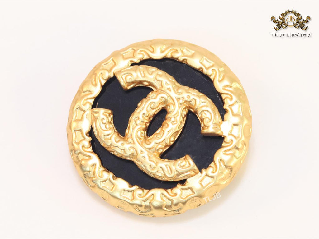 Double C gold foil and black enamel brooch