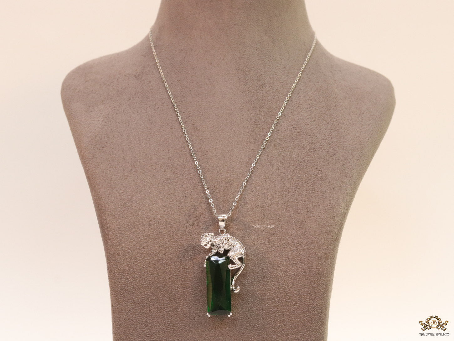 Platinum plated leopard on green stone pendant necklace with cz
