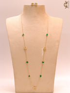 Emerald green clover heart and other shape charms on a sleek long gold plated chain with matching studs