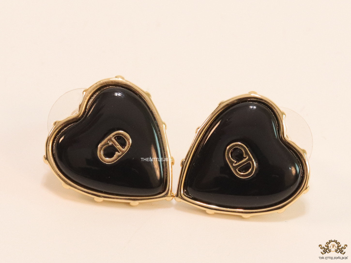 Heart shape black stud earrings with golden alphabets