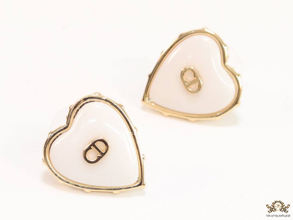 Heart shape white stud earrings with golden alphabets