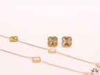 Pearl white clover heart and other shape charms on a sleek long gold plated chain with matching studs