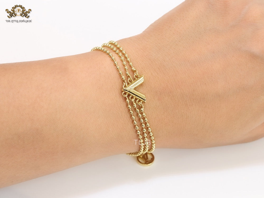 Alphabet V triple layered gold bracelet
