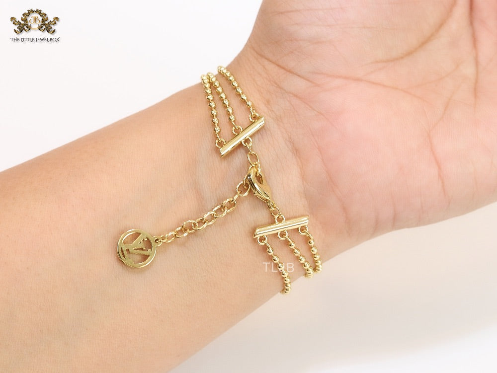 Alphabet V triple layered gold bracelet