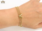 Alphabet V triple layered gold bracelet