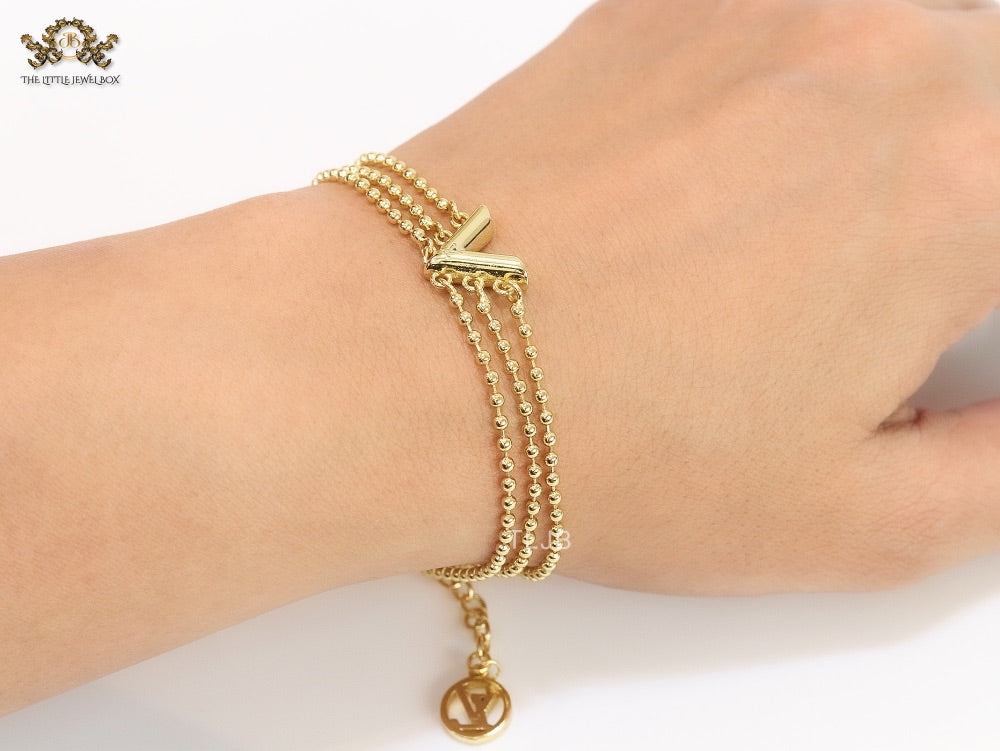 Alphabet V triple layered gold bracelet