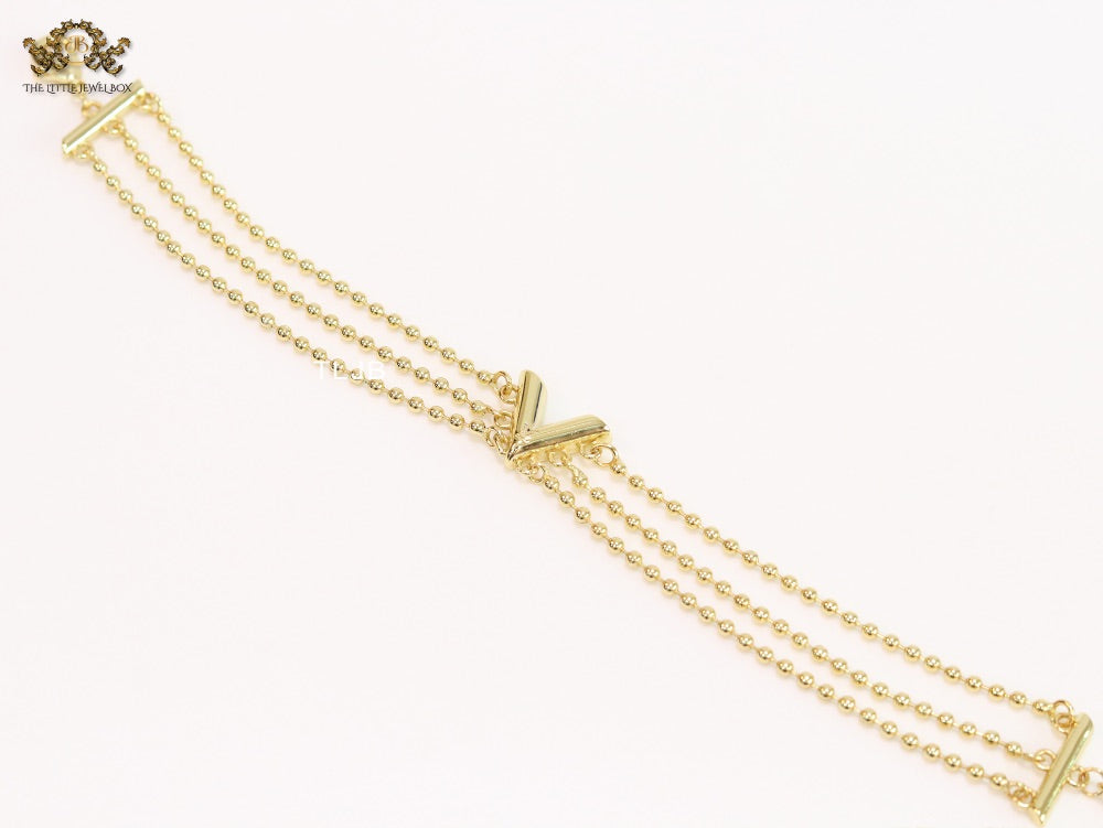Alphabet V triple layered gold bracelet