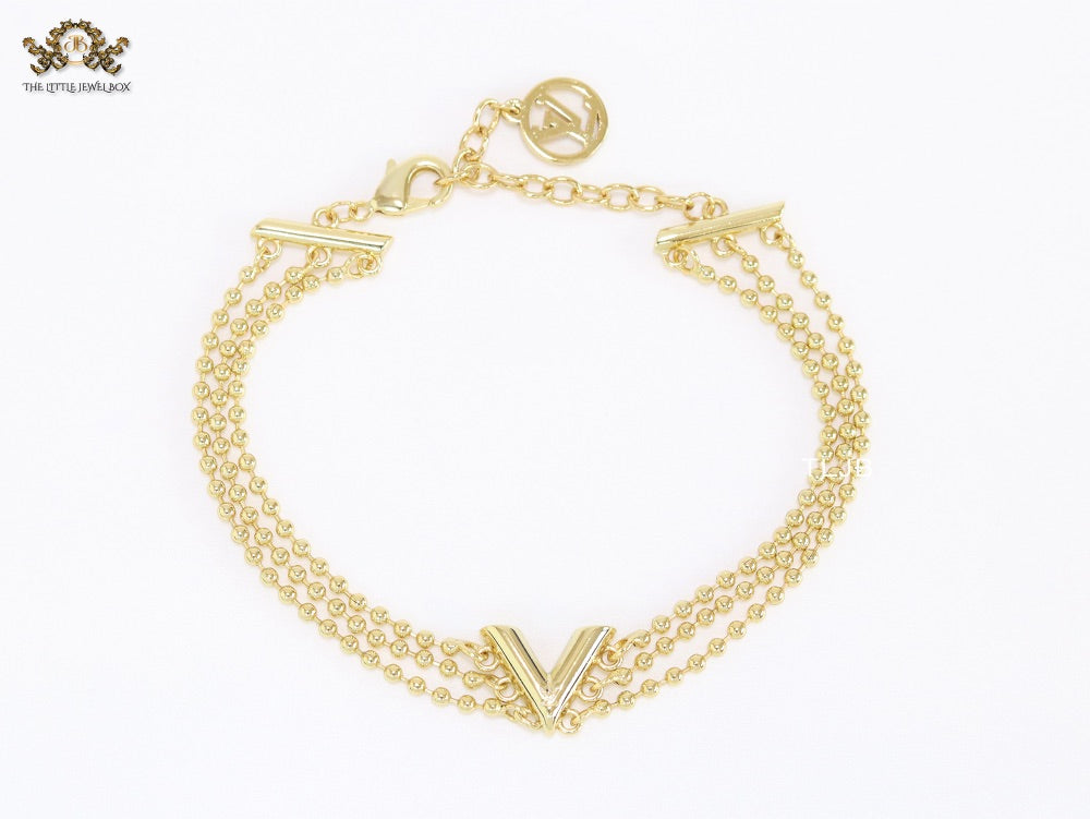 Alphabet V triple layered gold bracelet