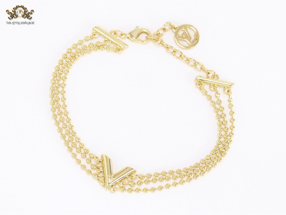 Alphabet V triple layered gold bracelet