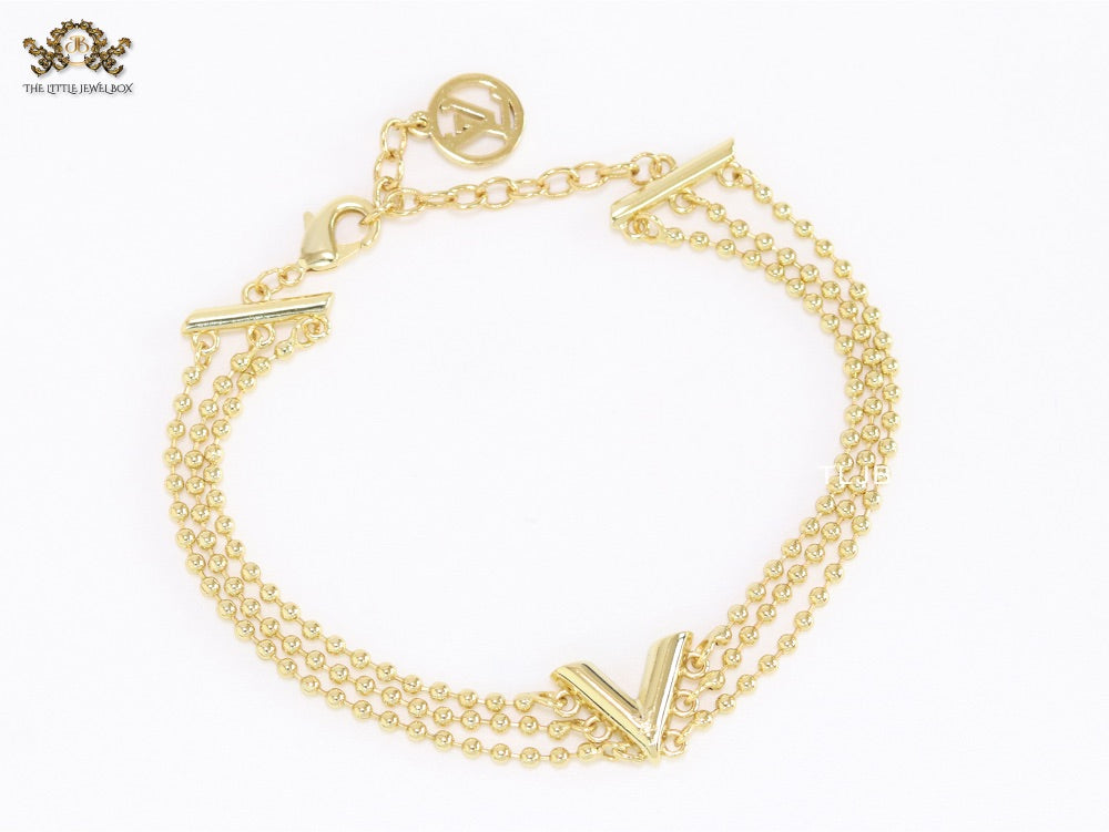Alphabet V triple layered gold bracelet