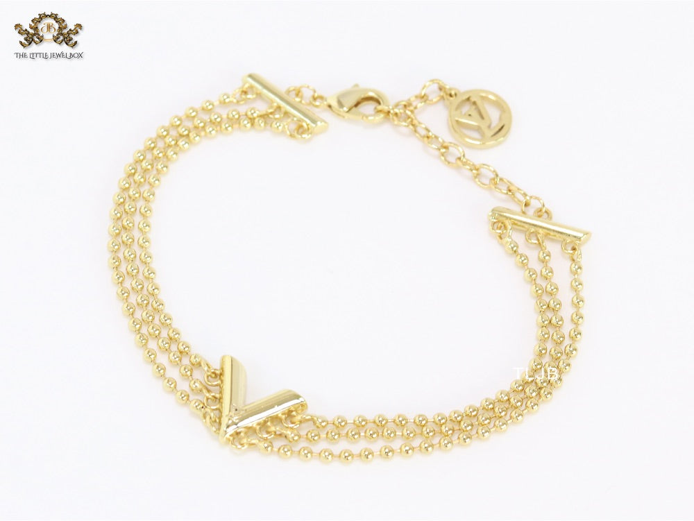 Alphabet V triple layered gold bracelet
