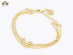 Alphabet V triple layered gold bracelet