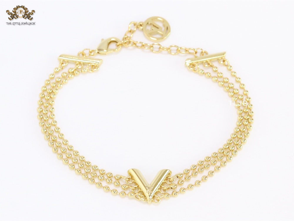 Alphabet V triple layered gold bracelet