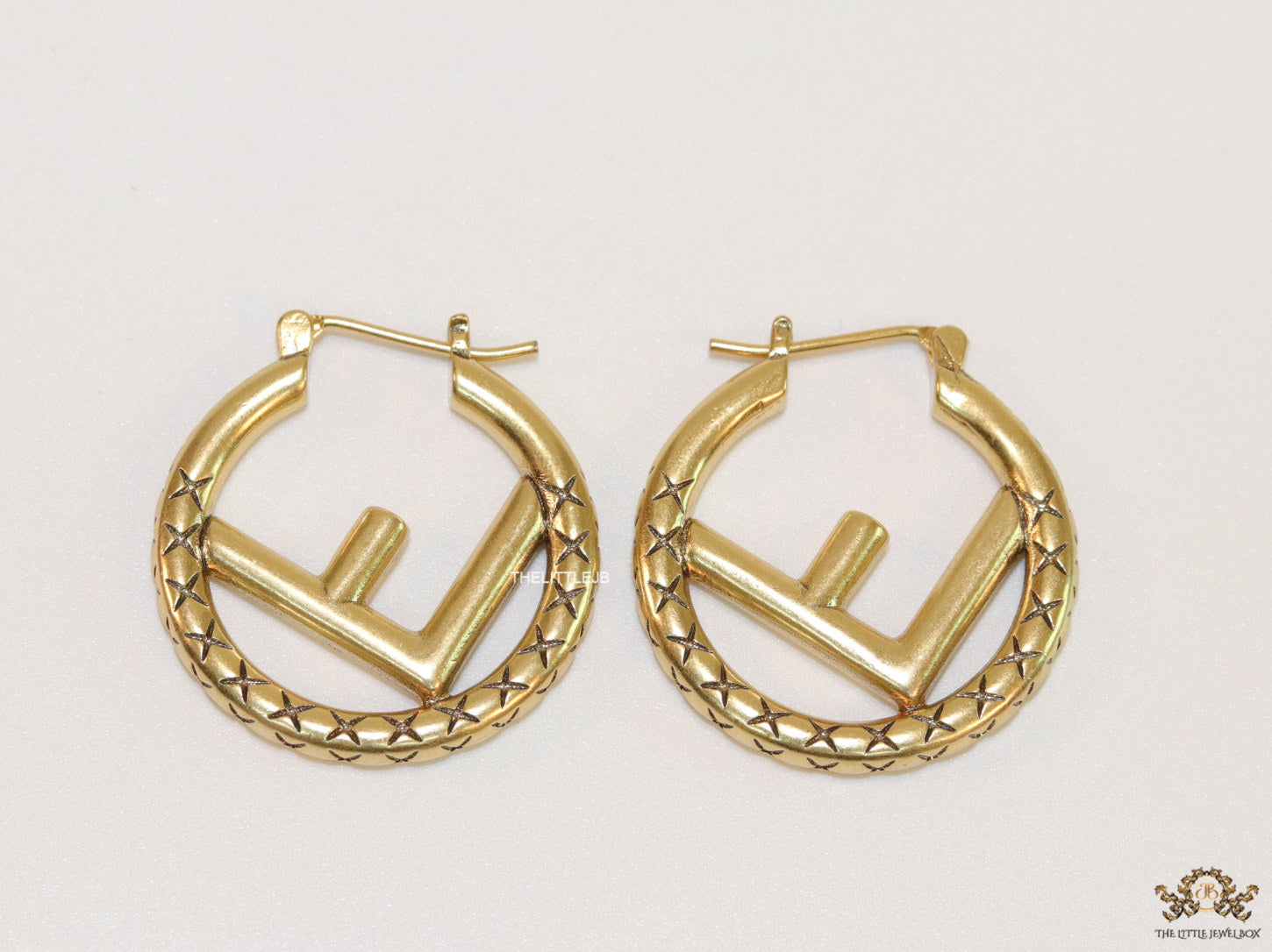 Designer golden hoops with alphabet motif