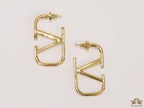 Designer golden earrings with alphabet motif