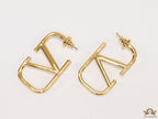 Designer golden earrings with alphabet motif