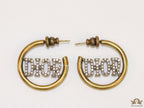Open golden hoops with cz alphabets