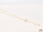 Sleek gold plated chain with different sized shell pearls.